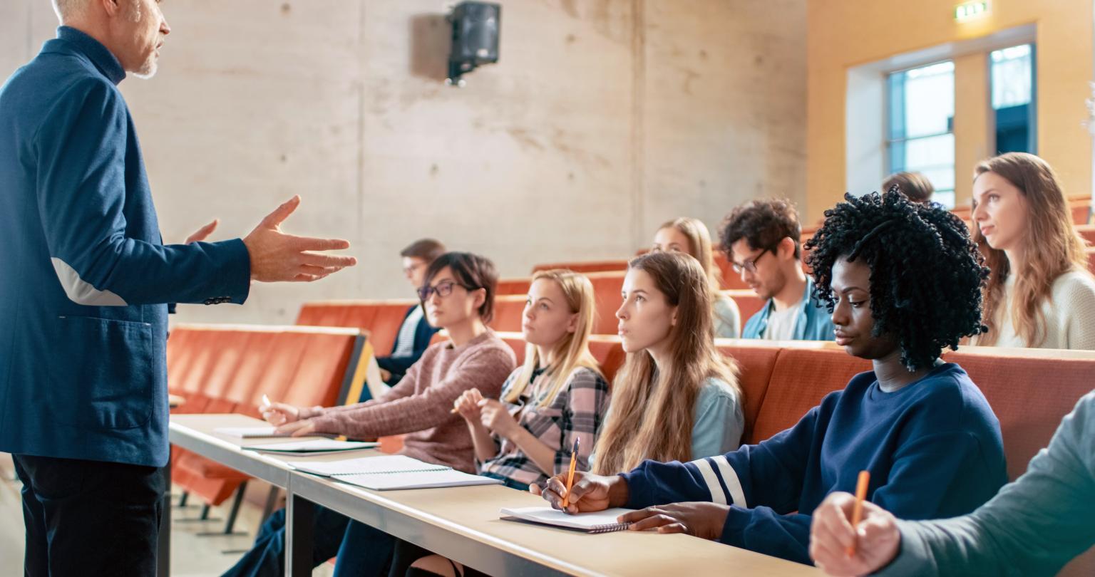 Professor Holding Lecture to a Multi Ethnic Group of Students.