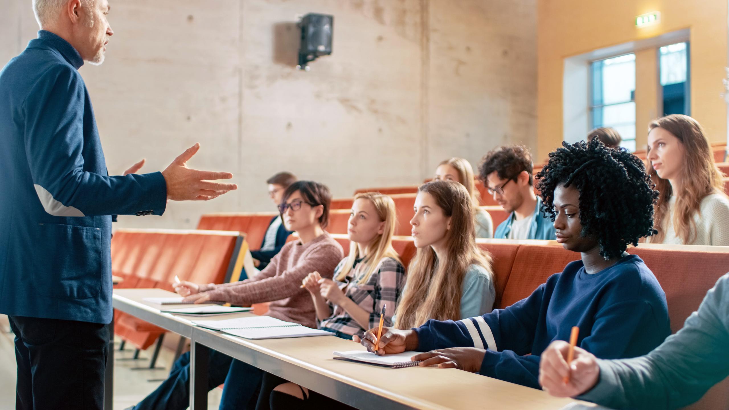 Professor Holding Lecture to a Multi Ethnic Group of Students.