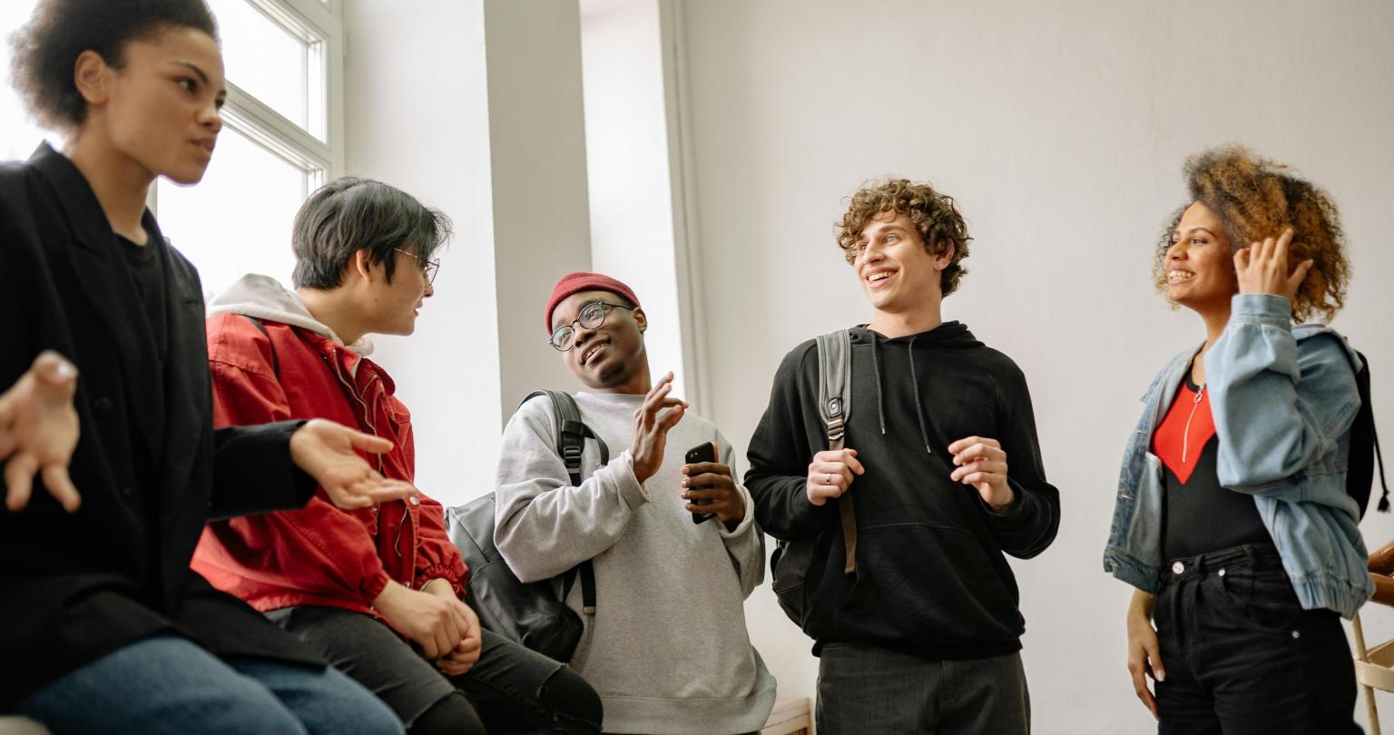 Group of Black students talking to each other.