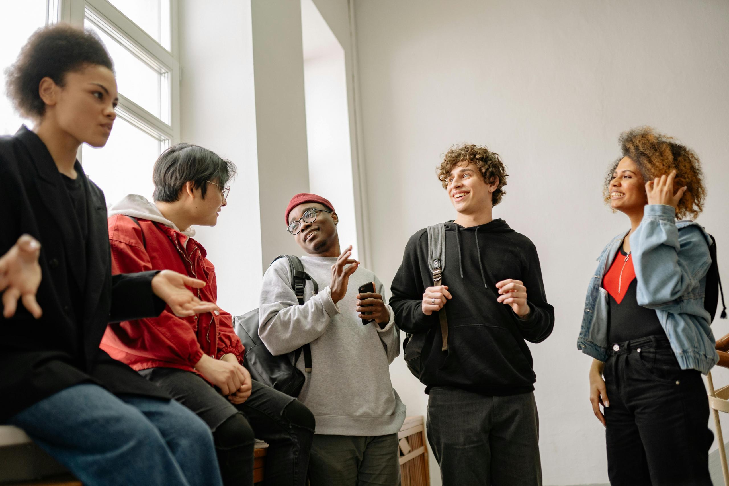 Group of Black students talking to each other.